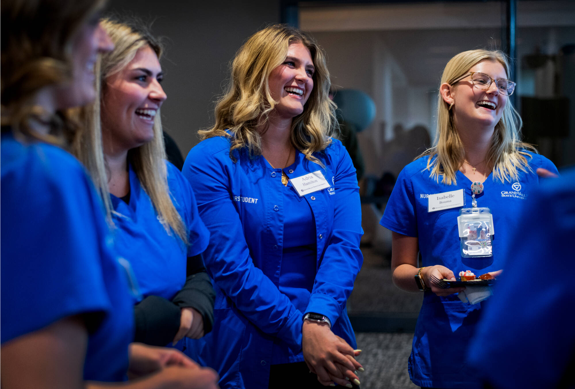 Nursing students, from left, Madison Resk, Adria Hamilton and Isabelle Bouma laugh together during and event celebrating the 4th anniversary of DCIH March 25.